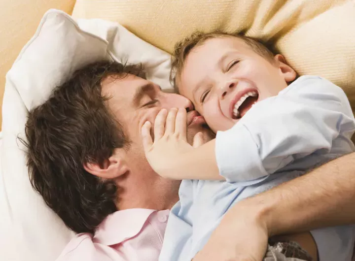 Dad_and_son_cuddling_Getty_93226515.webp